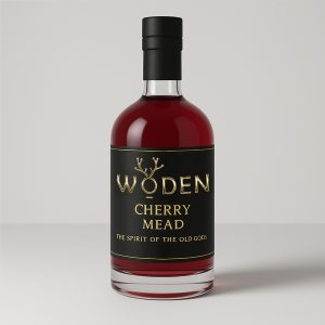 Bottle of Woden Cherry Mead with black and gold label, filled with deep red artisan mead, photographed against a neutral background.