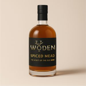 Bottle of Woden Spiced Mead with amber honey tones, black and gold label, and warming spiced flavours of cinnamon and clove.
