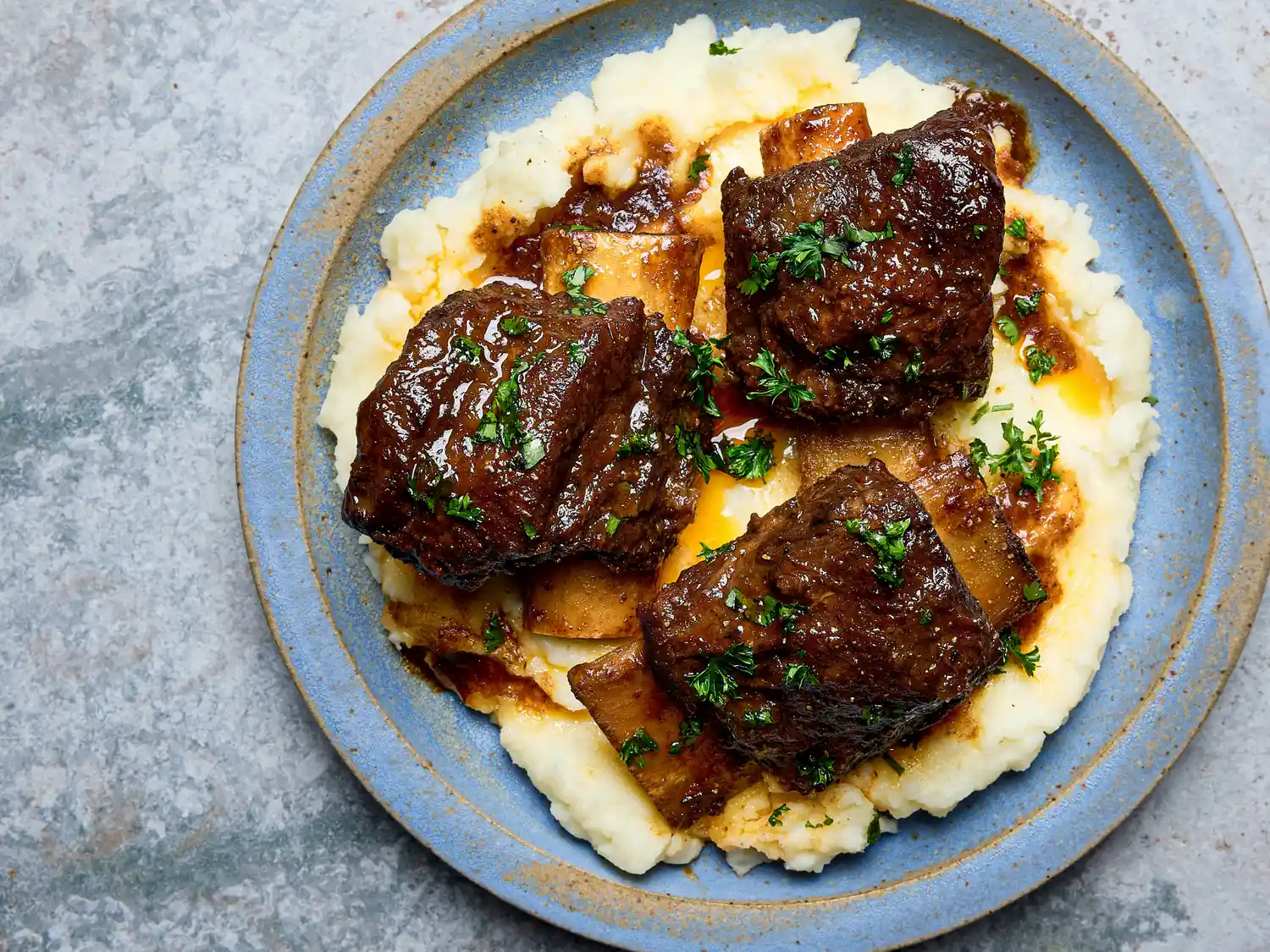 Braised short ribs served on mashed potato