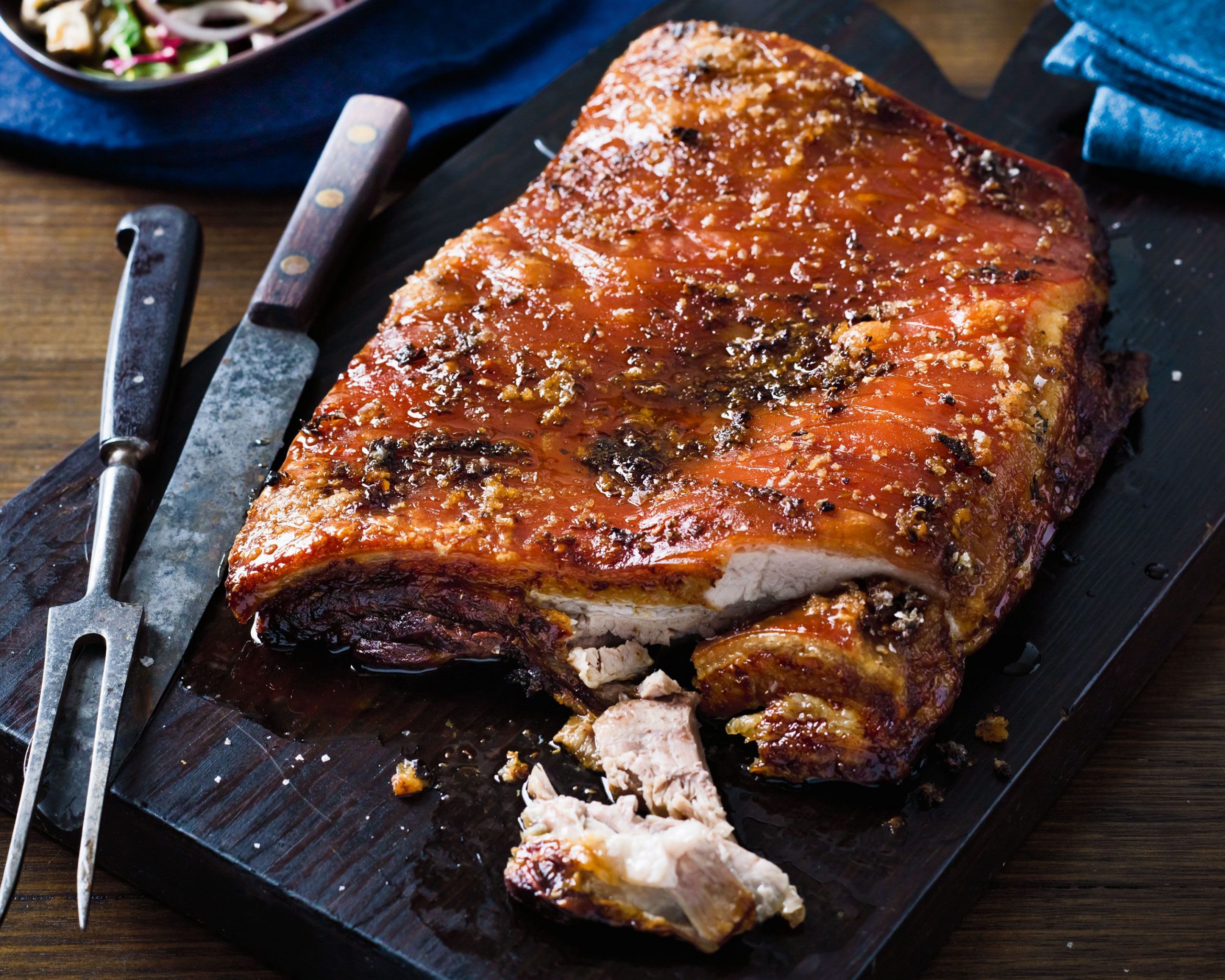Pork belly roasting in a pan